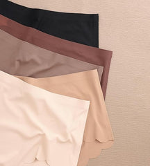 Four fabric swatches in black, brown, beige, and white on a textured beige background